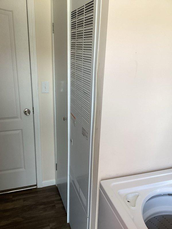 Completed comprehensive estimate for air conditioning system replacement at residential property. Assessed existing HVAC infrastructure, including electrical panel configuration and equipment access points in utility/laundry area. Documented current system location, electrical service capacity, and installation requirements for proposed replacement unit. Photographed existing conditions including equipment placement, electrical panel specifications, and workspace constraints to provide accurate replacement system recommendations and installation planning.