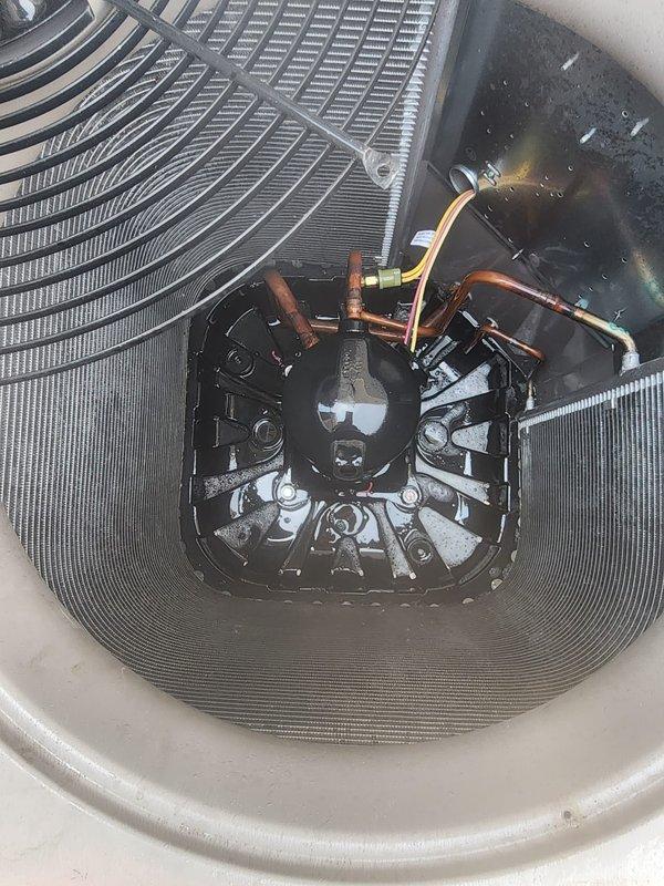 Responded to no-cooling complaint on 8-year-old air conditioning system running continuously with indoor temperature at 81°F despite thermostat set to 76°F. Upon arrival, performed comprehensive system diagnostics using digital manifold gauge set to measure operating pressures and temperatures. Inspection revealed low refrigerant charge indicated by abnormal suction and discharge pressures and temperatures. Conducted leak detection procedures and identified refrigerant leak in system. Recovered remaining refrigerant per EPA regulations, repaired leak, evacuated system to remove moisture and non-condensables, and recharged unit to manufacturer specifications using appropriate refrigerant type. Verified proper superheat and subcooling values post-repair. Confirmed condenser fan motor operation, inspected condenser coils for cleanliness and airflow obstruction, and verified all electrical connections secure. System tested and operational with proper cooling capacity restored, achieving ta