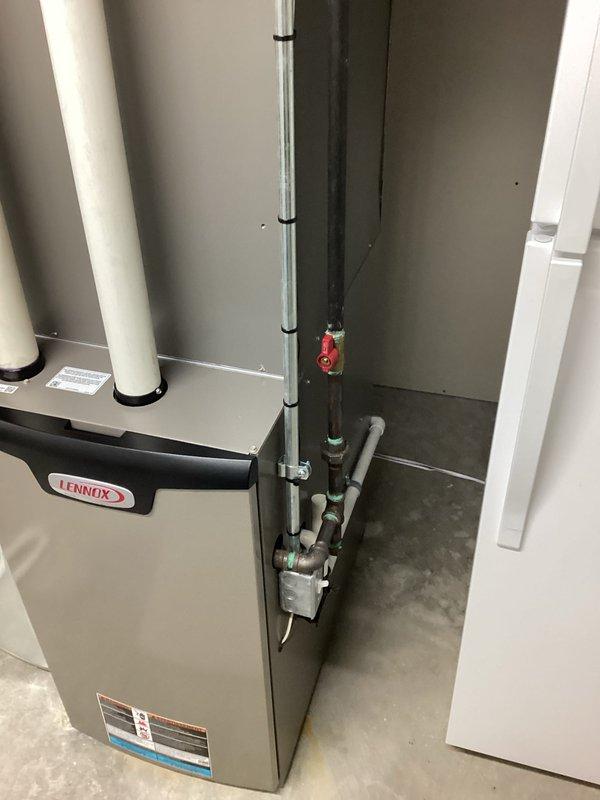 Provided comprehensive HVAC system replacement estimate for residential installation. Assessed existing basement utility room configuration including Lennox furnace unit, galvanized metal ductwork plenum with proper seam and rivet connections, white PVC condensate drain and vent piping with secure mounting brackets, and associated plumbing connections with shutoff valves. Documented current system layout featuring air handler equipment, vertical exhaust/intake venting, insulated water lines, and organized pipe routing on concrete floor foundation. Generated multiple quote options (04082-02 and 04082-03) for air conditioning replacement with estimated 4-6 PM installation timeframe, evaluating integration requirements with existing ductwork infrastructure and mechanical room space constraints.