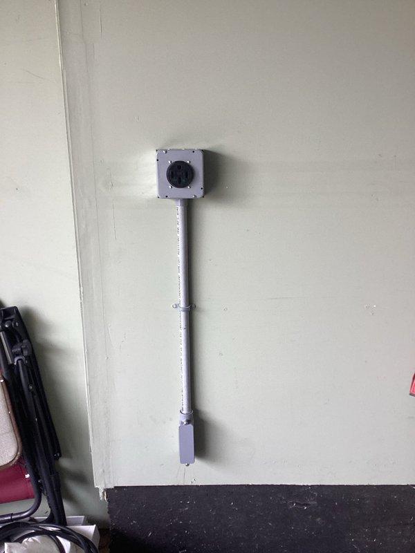 Installed a new 50-amp, 240-volt dedicated circuit with GFCI-protected EV-rated receptacle on the left garage wall, including EMT conduit installation, proper torquing of all terminations to manufacturer specifications, and coordination of required permit and inspection. Additionally, retrofitted existing recessed lighting fixtures in the living room with LED units and replaced bulbs in the living room ceiling fan and front post light.