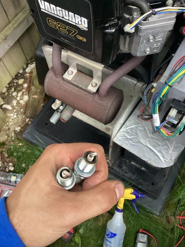 Performed scheduled preventive maintenance on Vanguard 627cc generator system. Inspected internal components, electrical control panel, and wiring harness connections. Removed and replaced spark plugs as part of routine maintenance protocol. Verified all mounting hardware, examined exhaust manifold assembly, and confirmed proper operation of electrical junction box and color-coded wire connections. Unit tested and returned to service in optimal working condition.