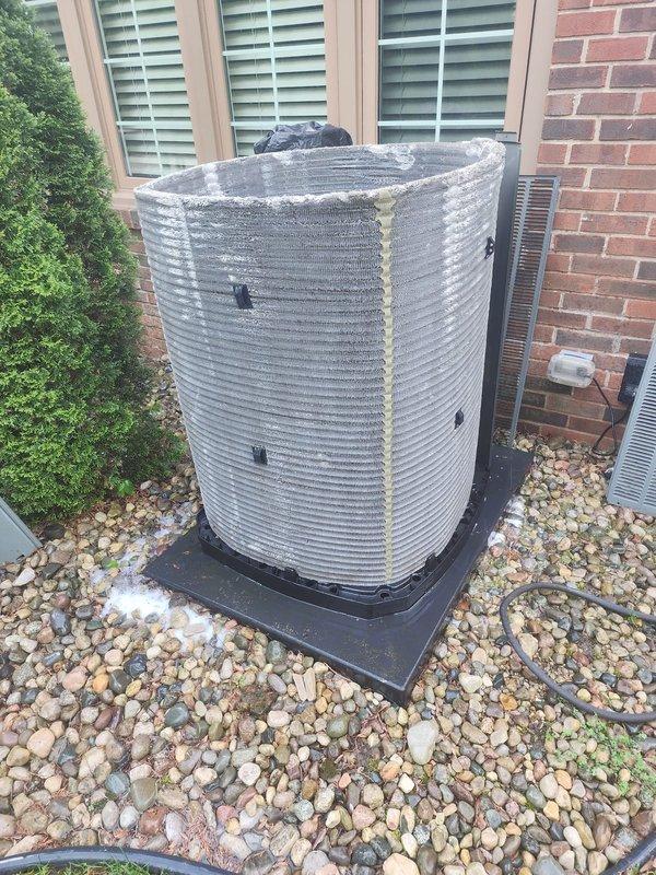 Completed scheduled air conditioning maintenance on residential split system. Performed system diagnostics using manifold gauges to check refrigerant pressures and verify proper operation. Inspected outdoor condenser unit, noting age-related weathering and mineral deposits on coil fins. All components operating within normal parameters at time of service.
