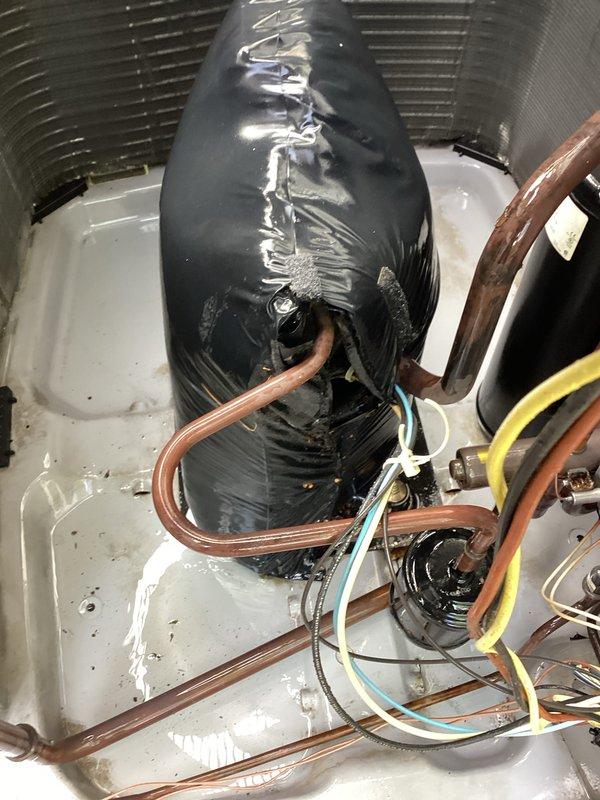 Responded to service call regarding blower not pushing air adequately in AC system. Upon inspection, discovered significant deterioration of insulation material on the evaporator coil assembly, with multiple tears and compromised sections exposing underlying surfaces. Examined air handler unit interior, noting heat exchanger coils and drain pan assembly appeared functional. Verified copper refrigerant lines and electrical connections were intact. Performed complete maintenance service on system, including inspection of all accessible components. System operation confirmed following service work.