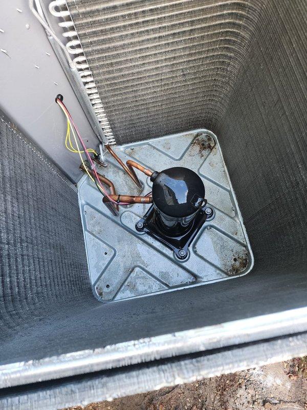 Performed comprehensive cooling system maintenance on residential air conditioning unit. Completed full system inspection including examination of outdoor condenser unit with curved aluminum fin design, verified compressor operation and refrigerant line connections, and documented equipment condition through detailed photography. System confirmed operational with no issues identified during tune-up service.