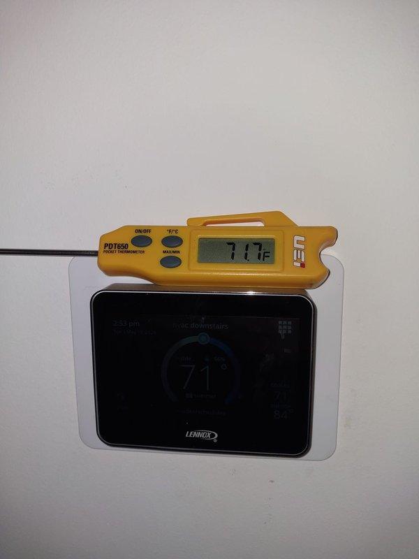 Installed Air Scrubber 10000 12-2 indoor air quality system to existing HVAC equipment. Verified proper operation and adjusted thermostat temperature offset settings to -5.0°F to ensure accurate temperature control with new IAQ equipment installed.