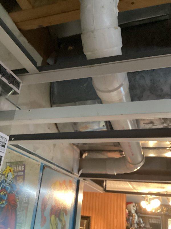 Completed comprehensive HVAC replacement estimate for air conditioning system. Assessed existing ceiling-mounted equipment, ductwork configuration, and mechanical infrastructure including PVC drain lines and exposed structural components to determine scope of replacement work. Documented current system conditions and provided detailed estimate for new AC installation.