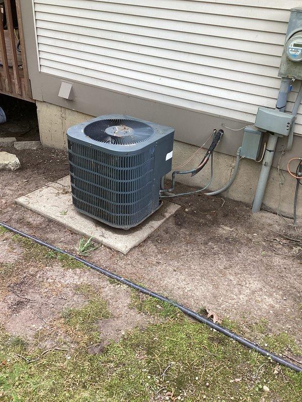 Conducted on-site evaluation of non-operational HVAC system for replacement estimate. Assessed existing outdoor air conditioning condenser unit and indoor furnace, both showing signs of age and deterioration. Documented equipment condition through photographic evidence, noting exposed insulation on furnace cabinet and overall system wear. Provided comprehensive replacement quote to address failed system components.