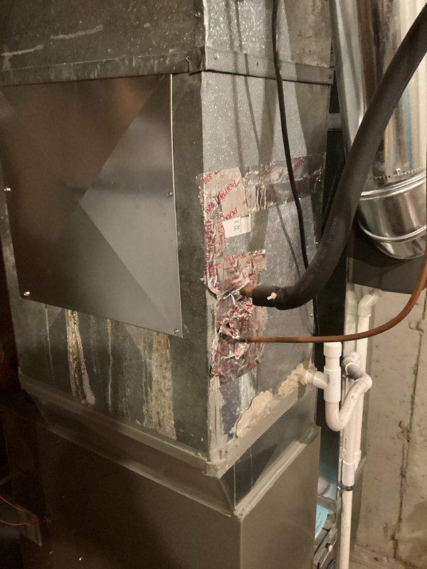 Conducted on-site evaluation of non-operational HVAC system for replacement estimate. Assessed existing outdoor air conditioning condenser unit and indoor furnace, both showing signs of age and deterioration. Documented equipment condition through photographic evidence, noting exposed insulation on furnace cabinet and overall system wear. Provided comprehensive replacement quote to address failed system components.