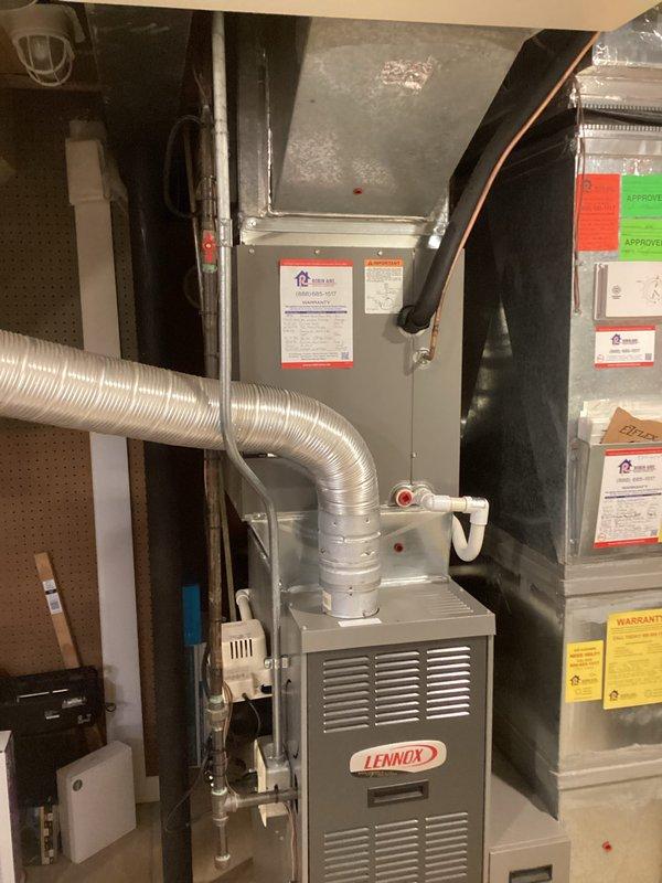 Responded to maintenance call where air conditioning system was found completely depleted of refrigerant. Upon assessment of the aging equipment—a 13-year-old AC unit and 18-year-old furnace—provided comprehensive replacement estimate. Documented existing Lennox HVAC system installation including furnace, air handler, flexible ductwork, and associated components in basement utility area for replacement planning purposes.