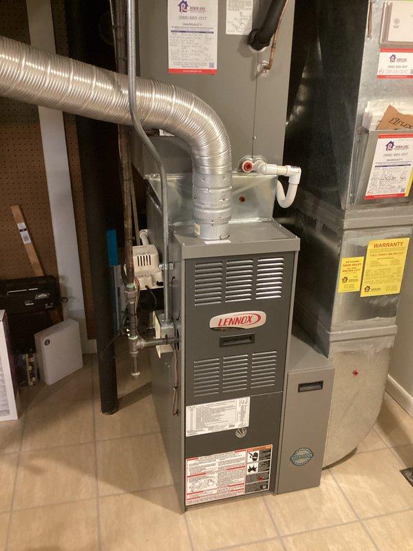 Responded to maintenance call where air conditioning system was found completely depleted of refrigerant. Upon assessment of the aging equipment—a 13-year-old AC unit and 18-year-old furnace—provided comprehensive replacement estimate. Documented existing Lennox HVAC system installation including furnace, air handler, flexible ductwork, and associated components in basement utility area for replacement planning purposes.