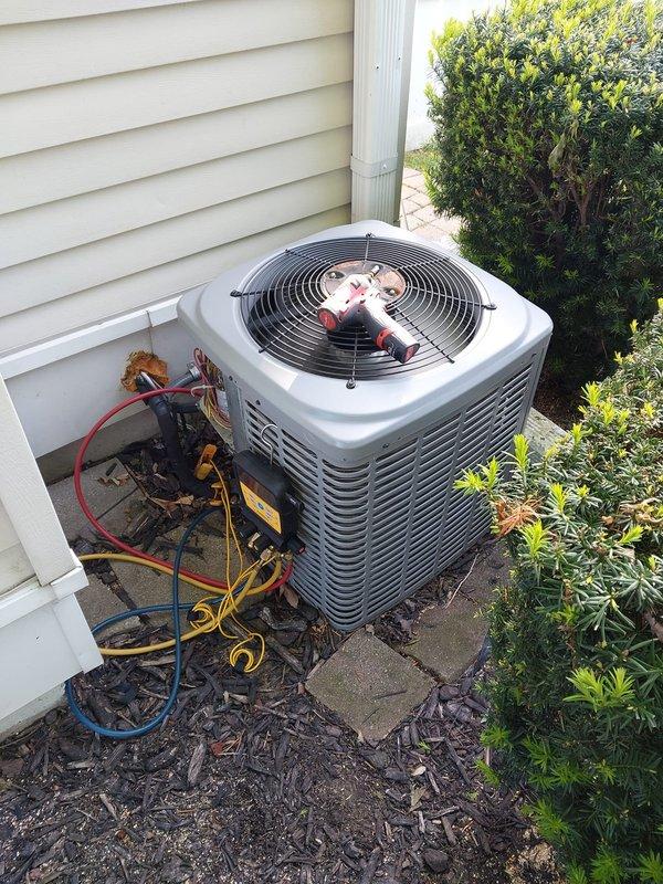 Completed routine air conditioning maintenance on residential condenser unit. Connected manifold gauges and verified refrigerant pressures and system performance. Inspected electrical connections, condenser coil condition, and fan operation. Unit operating within normal parameters upon completion of maintenance service.