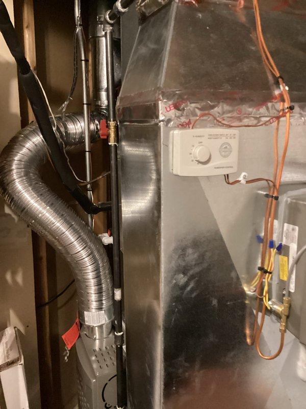 Conducted replacement estimate for existing R-22 air conditioning system previously flagged for replacement. Assessed current air handler unit showing significant age-related deterioration including surface discoloration, condensation staining, and accumulated dirt buildup on metal plenum. Documented existing equipment configuration including copper refrigerant lines, flexible ductwork connections, and control panel mounting. Photographed installation area in basement mechanical room to provide comprehensive system evaluation for replacement proposal. Coordinated arrival time with occupant prior to scheduled appointment window.