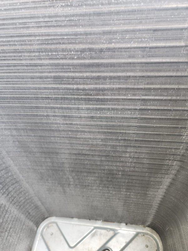 Completed scheduled cooling system maintenance and tune-up on residential HVAC unit. Performed comprehensive inspection of evaporator coil, condenser coil, refrigerant lines, and electrical connections. System found in operational condition with minor dust accumulation on coil fins; all components functioning within normal parameters and unit operating properly at time of service completion.