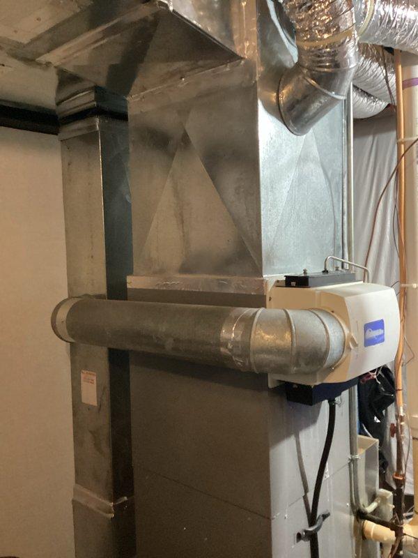 Performed estimate for complete HVAC system replacement on residential property. Existing air conditioning system was found to be completely empty of refrigerant, with history of previous refrigerant recharge including leak sealer application. Evaluated outdoor condenser unit installed under pergola structure on gravel pad with proper electrical disconnect, and inspected indoor air handler/furnace unit in basement with associated ductwork and plenum system. Due to ongoing refrigerant loss and customer's decision not to pursue further repairs on existing equipment, provided comprehensive replacement quote for new system installation.