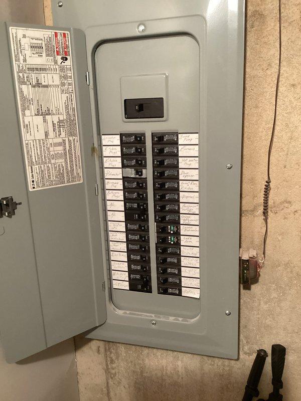 Completed estimate for air conditioning system replacement. Existing outdoor condenser unit evaluated due to age and low refrigerant levels, indicating system has reached end of serviceable life. Assessed current installation including condenser positioned on concrete pad with gravel surround, refrigerant lines, electrical disconnect, and PVC condensate drainage system. Reviewed electrical service panel for compatibility with replacement equipment requirements. Provided two quote options for system replacement to address cooling system failure.