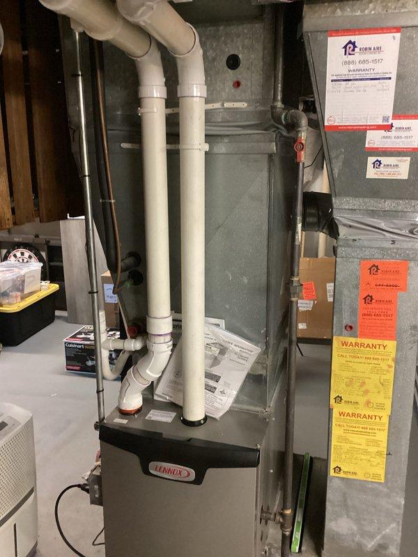 Completed diagnostic assessment on existing Lennox HVAC system revealing failed capacitor and motor drawing excessive amperage beyond manufacturer specifications. System exhibited operational deficiencies requiring component replacement to restore proper function. Evidence of condensate drainage issues observed with rust staining present at unit base, indicating potential secondary concerns with moisture management system requiring attention during future service intervals.
