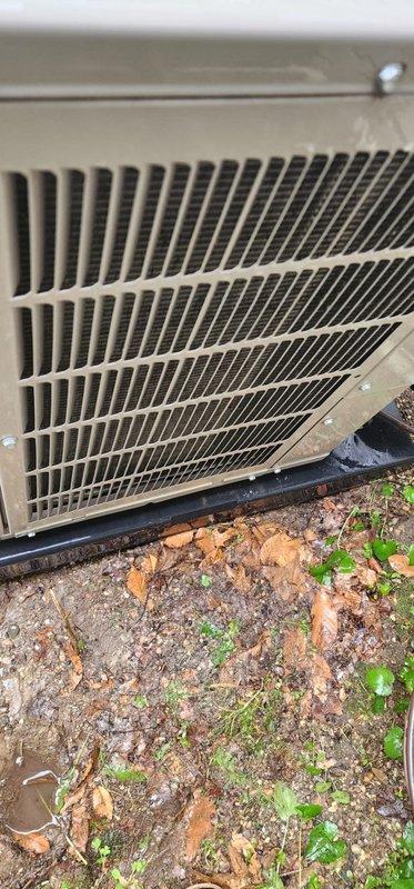 Completed scheduled A/C maintenance on outdoor condensing unit. Performed visual inspection of fan assembly through protective grille, confirming proper blade condition and electrical connections. Unit exterior and surrounding area show normal outdoor weathering with minimal debris accumulation; system operational and ready for cooling season.
