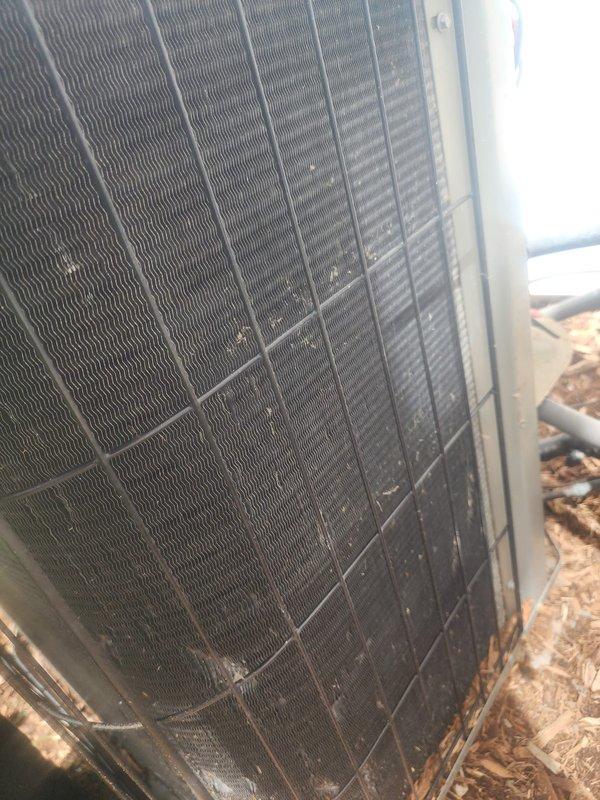 Completed comprehensive cooling system tune-up on operational HVAC unit. Performed standard maintenance protocol including inspection of condenser coil, which showed significant accumulation of dirt, debris, and grime reducing airflow efficiency. Cleaned condenser fins, checked fan operation, verified system performance, and confirmed unit returned to optimal operating condition.