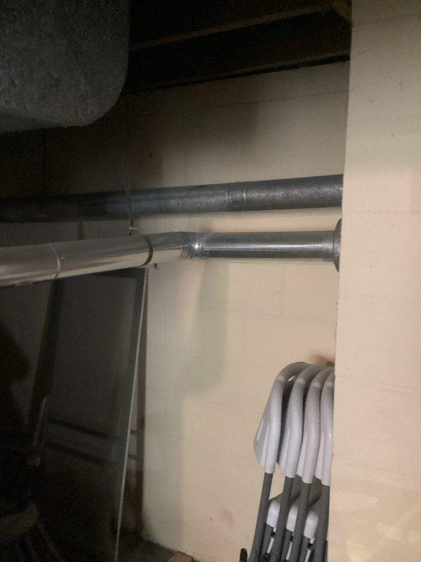Conducted HVAC system replacement estimate at residential property as requested for afternoon appointment after 2:45 PM. Assessed existing heating and cooling equipment located in basement utility area, documented current system configuration including ductwork, piping infrastructure, and mechanical components mounted on walls with metal brackets. Photographed installation site conditions to provide comprehensive replacement proposal for customer review.