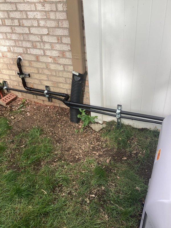 Completed installation of Briggs & Stratton 18kW standby generator with 100-amp automatic transfer switch at residential property. Routed natural gas supply line from existing meter to generator location using black iron pipe with approved fittings and yellow CSST flexible connector, installed exterior drainage management system to protect foundation area, and verified all electrical connections meet code requirements for safe automatic operation during power outages.