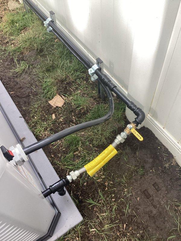 Completed installation of Briggs & Stratton 18kW standby generator with 100-amp automatic transfer switch at residential property. Routed natural gas supply line from existing meter to generator location using black iron pipe with approved fittings and yellow CSST flexible connector, installed exterior drainage management system to protect foundation area, and verified all electrical connections meet code requirements for safe automatic operation during power outages.