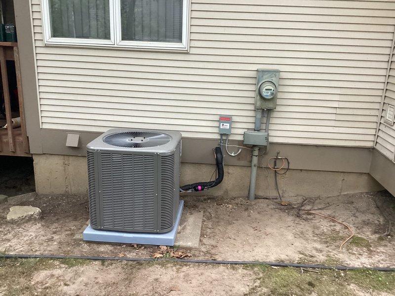 Completed installation of Lennox air conditioning system at residential property. Mounted condenser unit on concrete pad with proper clearances, installed electrical disconnect box with AC service identification, and connected all refrigerant lines with appropriate insulation. All electrical connections were made to existing service panel, system was tested for proper operation, and site was left clean and ready for use.