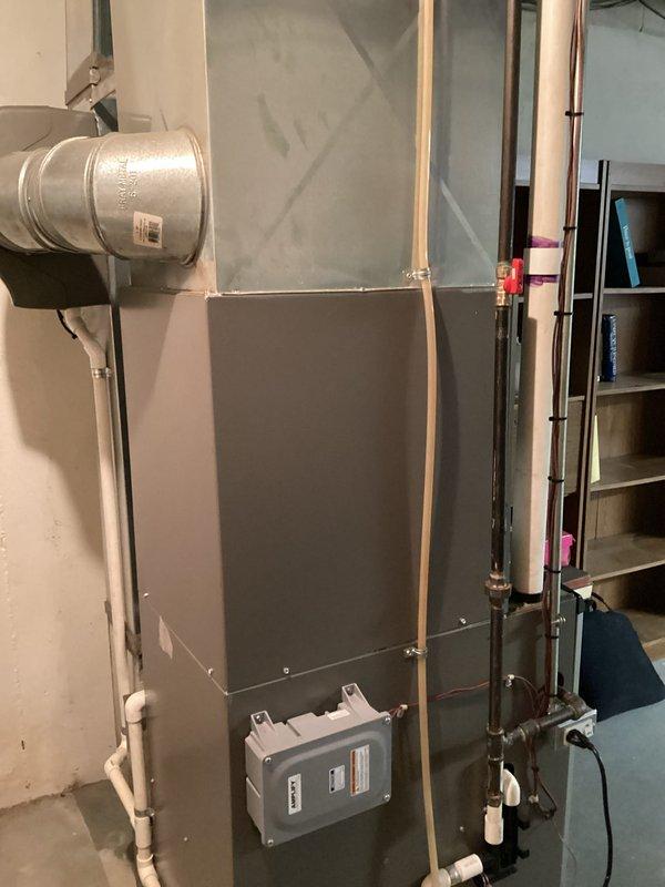 Performed comprehensive assessment of existing HVAC system including Lennox furnace and air conditioning unit. System evaluation revealed air conditioning unit was low on refrigerant and approximately 10 years old, indicating potential for future reliability issues. Documented existing equipment configuration including furnace, air handler, copper refrigerant lines with service valves, ductwork connections, and associated mechanical components. Prepared replacement estimates for customer consideration to address aging equipment and refrigerant loss concerns.
