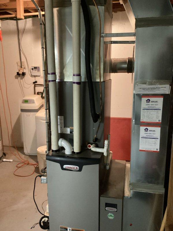 Performed comprehensive assessment of existing HVAC system including Lennox furnace and air conditioning unit. System evaluation revealed air conditioning unit was low on refrigerant and approximately 10 years old, indicating potential for future reliability issues. Documented existing equipment configuration including furnace, air handler, copper refrigerant lines with service valves, ductwork connections, and associated mechanical components. Prepared replacement estimates for customer consideration to address aging equipment and refrigerant loss concerns.