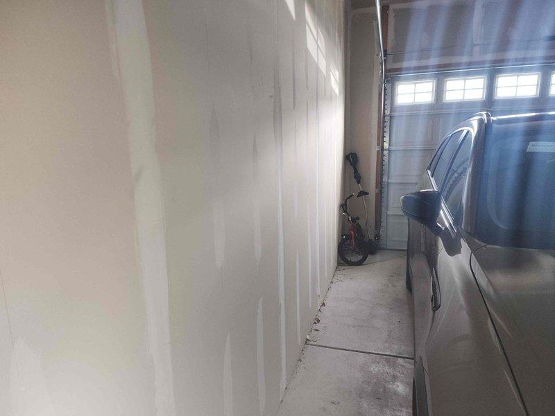 Conducted comprehensive site assessment for electric vehicle charging station installation in residential garage. Evaluated electrical infrastructure requirements, examined wall construction and mounting locations, and documented existing conditions including drywall surfaces and available space for Level 2 EV charger placement. Provided detailed estimate for installation of 240-volt dedicated circuit, appropriate conduit routing, and charging equipment mounting to accommodate 3-5 parking positions.