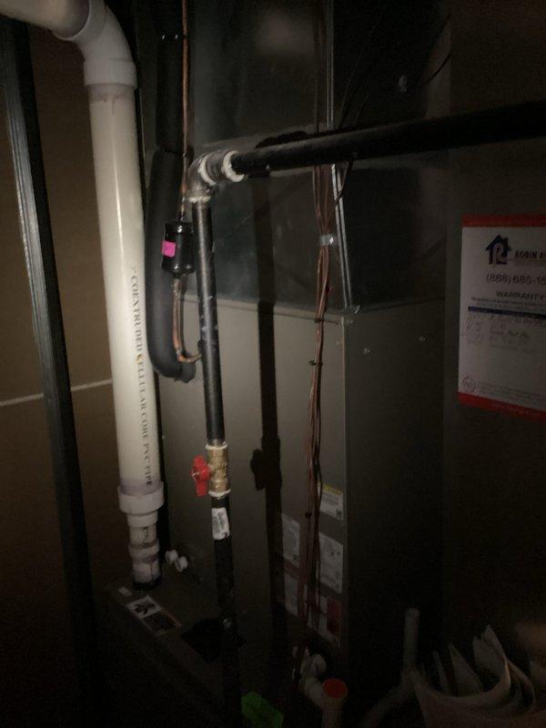 Completed on-site estimate for furnace replacement in residential basement utility area. Evaluated existing HVAC system configuration including furnace unit, refrigerant lines, electrical connections, and associated plumbing components. Documented current equipment specifications, installation conditions, and spatial requirements for replacement unit recommendations.