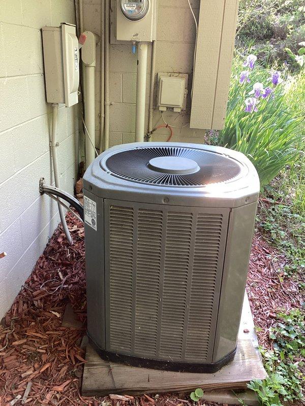 Responded to service call for 22-year-old Trane air conditioning system experiencing freeze-up after approximately 3 hours of runtime. Evaluated outdoor condenser unit and determined probable slow refrigerant leak as cause of icing condition. Due to advanced system age and refrigerant availability concerns, prepared comprehensive estimate for replacement 3.5-ton AC system with indoor blower unit to be installed in garage location with favorable accessibility for equipment changeout.