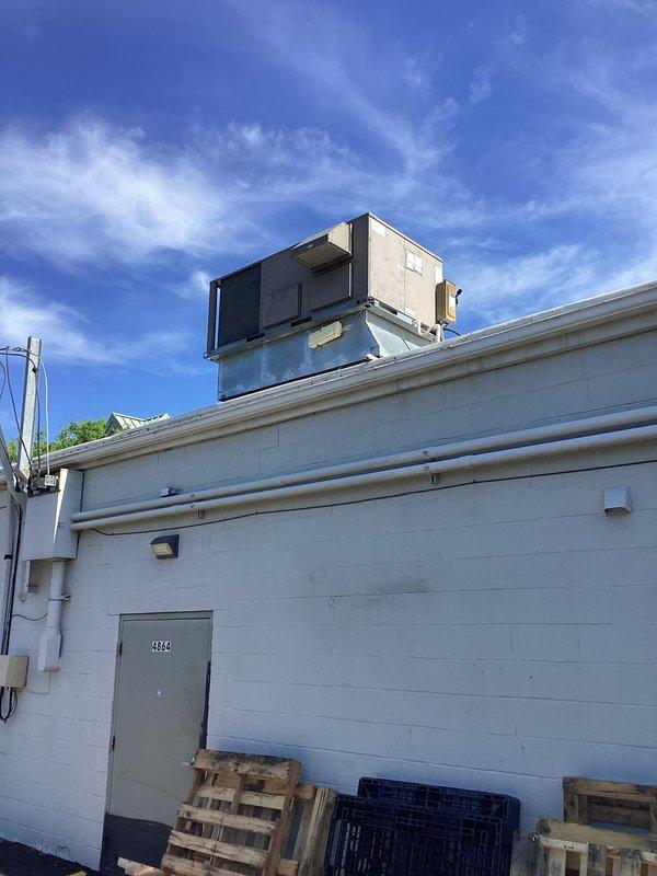 Conducted commercial rooftop unit replacement estimate for building #2334. Assessed existing RTU system that was previously evaluated by another contractor who recommended replacement over repair due to cost considerations. Documented current rooftop unit condition, mounting configuration on roof curb, associated electrical service panel, and conduit routing on exterior wall. Provided comprehensive replacement proposal for commercial-grade HVAC equipment.