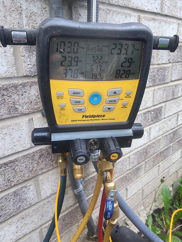 Responded to service call for newly installed air conditioning system struggling to maintain temperature during peak afternoon hours. Connected Fieldpiece SMAN refrigerant manifold and micron gauge to evaluate system performance and refrigerant charge. Measured operating pressures, temperatures, and superheat/subcooling values on R454B refrigerant system. Initial readings indicated system parameters were within acceptable range. Monitored compressor operation and verified proper airflow across evaporator and condenser coils. System appeared to be operating as designed with no immediate refrigerant leaks or mechanical deficiencies detected. Advised that newly installed equipment may require brief break-in period and continued monitoring during extreme heat conditions to establish baseline performance.