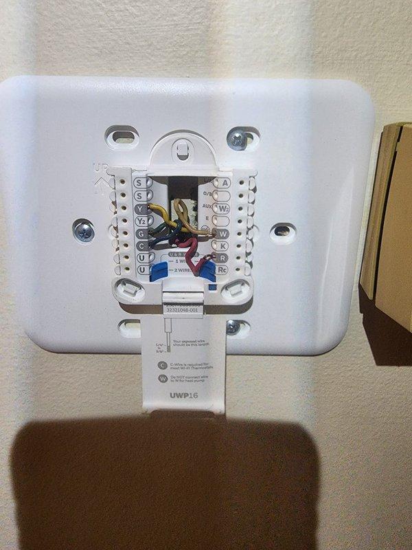 Responded to callback for non-functional HVAC system following recent furnace installation. Upon arrival, verified thermostat had no control over air conditioning or fan operation. Inspected thermostat wiring connections at wall-mounted control interface and traced low-voltage wiring to furnace control board. Identified improper wire terminations at equipment that were preventing communication between thermostat and HVAC system. Corrected all low-voltage wire connections at furnace terminal block, ensuring proper placement of R, C, Y, and G wires according to manufacturer specifications. Tested system operation and confirmed air conditioning and fan now respond correctly to thermostat commands.