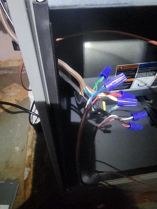 Responded to callback for non-functional HVAC system following recent furnace installation. Upon arrival, verified thermostat had no control over air conditioning or fan operation. Inspected thermostat wiring connections at wall-mounted control interface and traced low-voltage wiring to furnace control board. Identified improper wire terminations at equipment that were preventing communication between thermostat and HVAC system. Corrected all low-voltage wire connections at furnace terminal block, ensuring proper placement of R, C, Y, and G wires according to manufacturer specifications. Tested system operation and confirmed air conditioning and fan now respond correctly to thermostat commands.