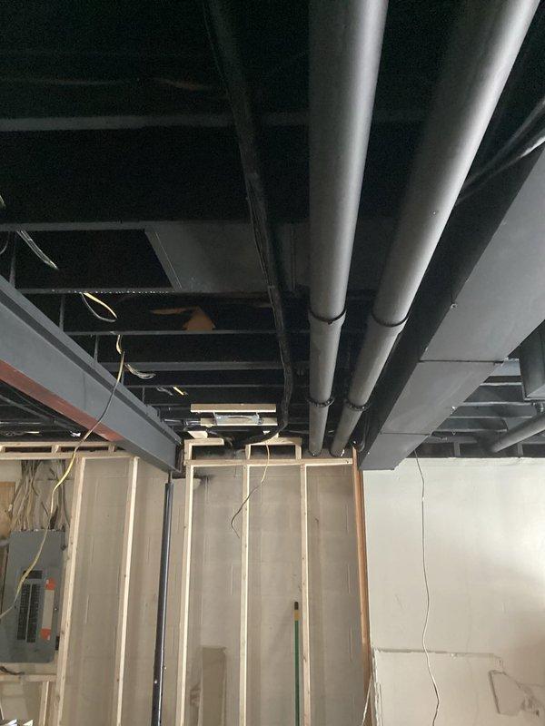Conducted comprehensive assessment of 9-10 year old air conditioning system experiencing seized fan motor failure. Unit operates on R-22 refrigerant, which is being phased out and increasingly difficult to service. Given the age of the equipment, seized motor condition, and refrigerant type, provided detailed replacement estimate for complete system upgrade. Documented existing basement installation with exposed ductwork and evaluated access points for potential new equipment installation.