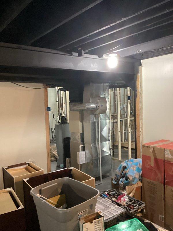 Conducted comprehensive assessment of 9-10 year old air conditioning system experiencing seized fan motor failure. Unit operates on R-22 refrigerant, which is being phased out and increasingly difficult to service. Given the age of the equipment, seized motor condition, and refrigerant type, provided detailed replacement estimate for complete system upgrade. Documented existing basement installation with exposed ductwork and evaluated access points for potential new equipment installation.