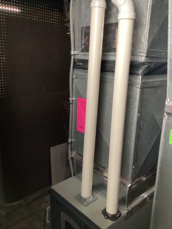 Completed comprehensive HVAC system replacement estimate for a residential split system installation. Assessment included evaluation of existing outdoor condenser unit with weathered components and indoor air handler with associated ductwork, condensate drainage system, and electrical connections. Documented current system configuration including refrigerant line routing, electrical disconnect placement, and equipment positioning for replacement specifications.