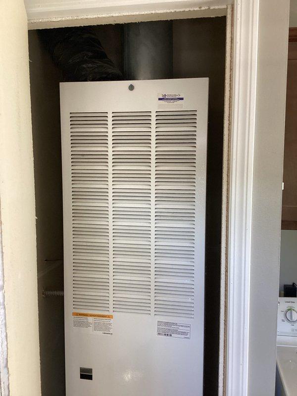 Conducted on-site assessment for HVAC system replacement at residential property. Evaluated existing furnace unit located in utility closet, documented current equipment configuration including louvered ventilation panels and existing warning labels, and captured detailed photographs of installation space to prepare comprehensive replacement estimate for customer consideration.