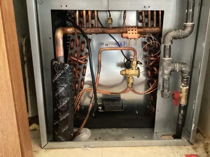 Completed installation of new Lennox air conditioning system at residential property. System includes outdoor condensing unit with associated refrigerant lines, electrical connections, and indoor air handler integration with existing ductwork. Installed Honeywell Home thermostat for system control and verified proper communication between control unit and equipment. All copper refrigerant lines properly insulated and secured, electrical connections made to code specifications, and system tested for proper operation including temperature differential and refrigerant charge verification. System operational and customer instructed on thermostat operation.