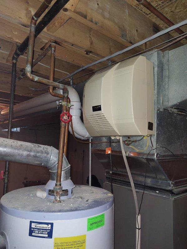 Responded to service call for humidifier replacement estimate after existing unit detached from HVAC system due to age-related failure. Inspected basement mechanical room containing furnace, ductwork, water heater, and failed humidifier unit mounted to air handling system. Assessed existing installation configuration, copper plumbing connections, electrical requirements, and ductwork compatibility. Documented equipment specifications and mounting location to provide comprehensive replacement estimate for new whole-house humidifier system with proper integration to existing HVAC infrastructure.