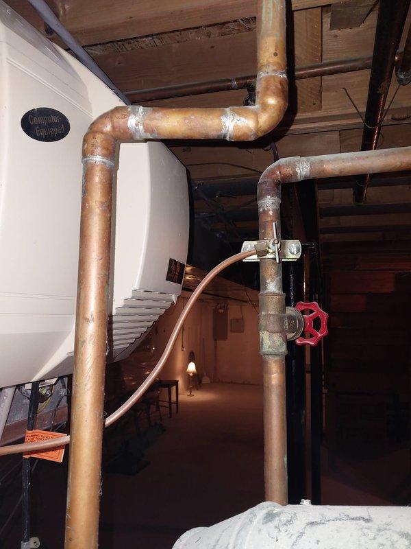 Responded to service call for humidifier replacement estimate after existing unit detached from HVAC system due to age-related failure. Inspected basement mechanical room containing furnace, ductwork, water heater, and failed humidifier unit mounted to air handling system. Assessed existing installation configuration, copper plumbing connections, electrical requirements, and ductwork compatibility. Documented equipment specifications and mounting location to provide comprehensive replacement estimate for new whole-house humidifier system with proper integration to existing HVAC infrastructure.