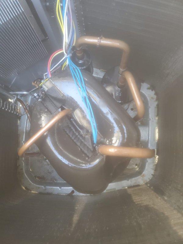 Completed comprehensive cooling system maintenance and tune-up on properly functioning HVAC unit. Inspected evaporator coil assembly in attic space, verifying all copper refrigerant lines, electrical connections, and mounting hardware were secure and in good condition. Examined outdoor condenser unit and filter assembly, noting accumulated dirt and debris on filter media requiring attention. All system components operational with no immediate repairs needed.