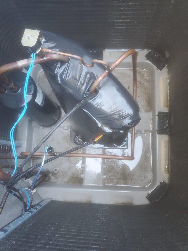 Completed routine preventative maintenance on Bryant air conditioning system. Inspected indoor air handler unit including evaporator coil, condensate drain pan, and drain line for proper operation. Condensate pan showed normal water staining with no blockages detected. Verified refrigerant lines and electrical connections secure. Proceeded to outdoor condenser unit and inspected condenser coil fins, which were clean and in good condition with no debris accumulation. Confirmed unit operational with all components functioning within normal parameters.