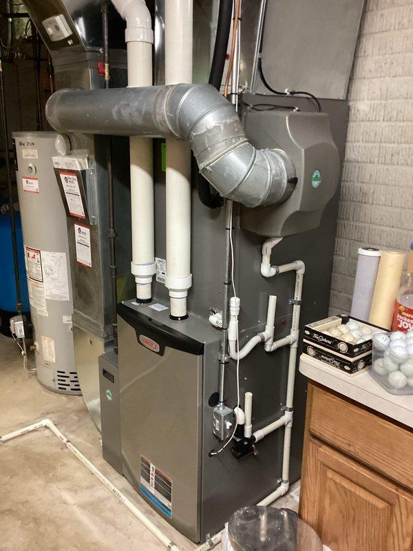 Completed site assessment for HVAC system replacement estimate at residential property. Documented existing furnace and water heater installation in basement mechanical room, including current ductwork configuration, PVC venting system, and equipment layout to provide accurate replacement specifications and equipment sizing recommendations.
