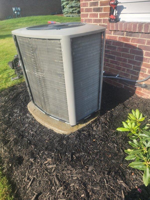 Responded to indoor air quality concern regarding elevated humidity levels reading 61% at thermostat. Performed system inspection and documented current equipment conditions, including examination of evaporator coil assembly, refrigerant lines, and outdoor condensing unit. Captured photographic documentation of HVAC components for service records and customer reference.