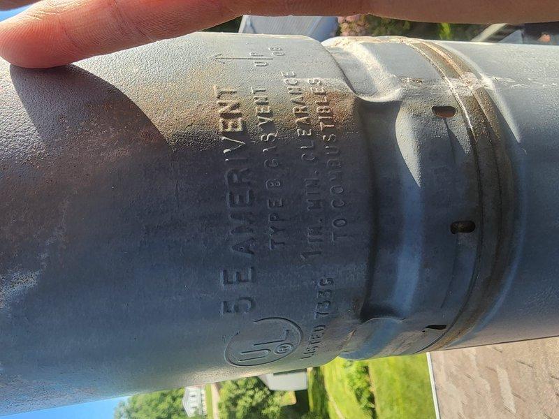 Responded to service call for missing chimney cap that had blown off during recent weather event. Upon arrival, inspected metal chimney pipe and confirmed cap was completely detached with visible deterioration and rust damage to the crown area. Documented existing condition showing compromised chimney components and replaced missing cap to restore proper ventilation protection and prevent water intrusion.