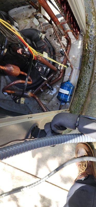 Completed comprehensive cooling system maintenance and tune-up on properly functioning HVAC unit. Performed thorough cleaning of outdoor condenser coils, inspected mechanical room components including copper refrigerant lines and circulation pump, and verified all system operations within normal parameters.