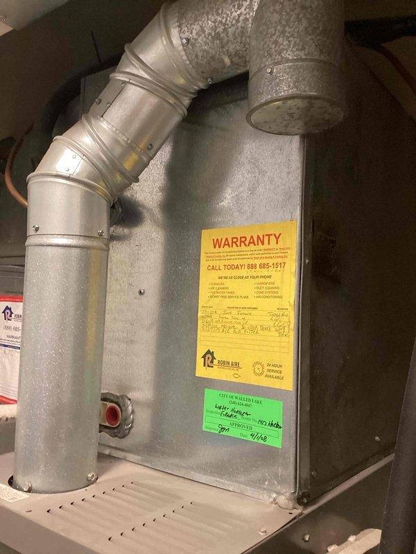 Conducted on-site assessment for air conditioning replacement in basement utility area. Evaluated existing HVAC system including air handler unit with connected ductwork and associated mechanical components. Documented current equipment configuration, noting existing warranty information from previous installation dated 2013. Photographed unit positioning, ductwork connections, copper refrigerant lines, and filter housing to provide comprehensive replacement estimate. Customer scheduled to receive diagnostic service call prior to final replacement decision.