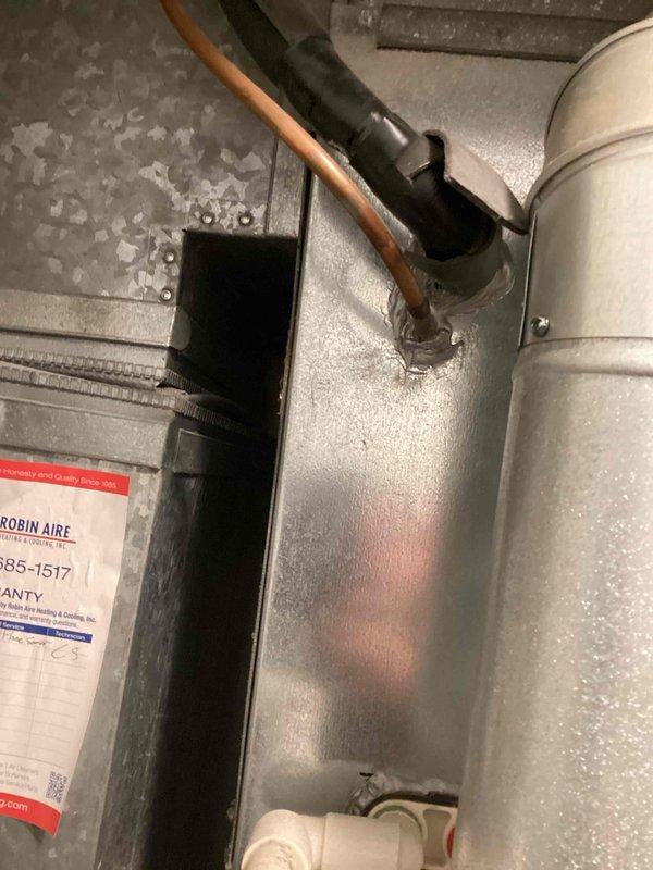 Conducted on-site assessment for air conditioning replacement in basement utility area. Evaluated existing HVAC system including air handler unit with connected ductwork and associated mechanical components. Documented current equipment configuration, noting existing warranty information from previous installation dated 2013. Photographed unit positioning, ductwork connections, copper refrigerant lines, and filter housing to provide comprehensive replacement estimate. Customer scheduled to receive diagnostic service call prior to final replacement decision.